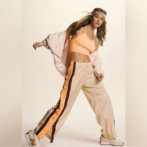 Free People Movement Beige Track Pants with Orange and Maroon Stripes - size L